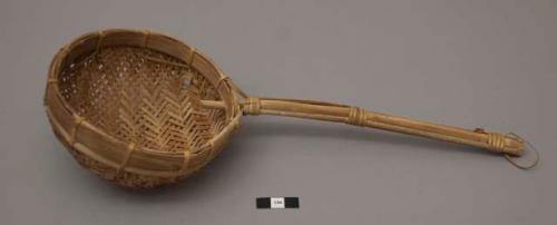 Basketry utensil with long handle; ladle?