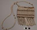 Small bag of ostrich eggshell beads and hide; 18 pendent strings of beads; long beaded strap; 4 eggshell buttons at top opening