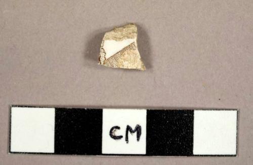 Whiteware sherd with brown transferprint decoration on exterior