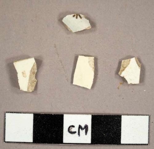 Earthenware sherds, including one whiteware with brown transfer print and three creamware sherds