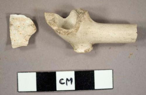 White kaolin pipe bowl fragments, including one with a stump and partial stem
