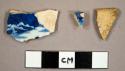 Blue transfer print whiteware sherds, including one plate rim sherd and one unglazed sherd