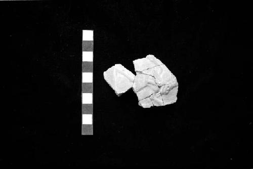 Ceramic sherd with low relief design from Site 128