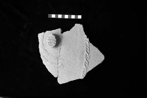 Ceramic sherd with applique lug, incisions and applique ribs with diagonal dent punctates from Site 128