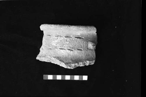 Rim sherd from face neck jar from Site 94