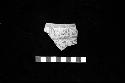 Sherd from ceramic vessel with inverted neck and dark red on cream slip from Site 135