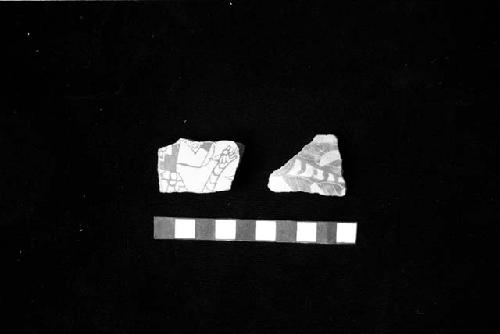 Florero sherd with warrior with snake belt from Site 134, and jar sherd with fish from Site 130