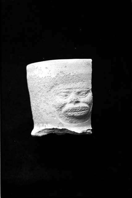 Small mold press molded face neck sherd from Site 133