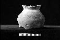 Ceramic vessel with press mold scrolls and lines from Site 131