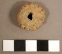 Spindle whorl. discoidal, thick row of vertical grooves around periphery. single