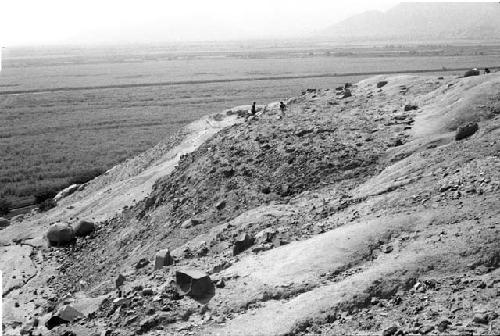 Platform with segmented conical adobes on west side of ridge at Site 93, containing Units 57 and 58