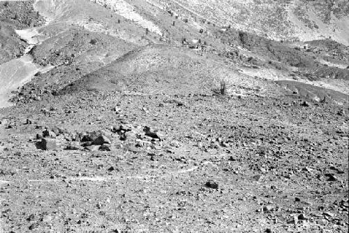 Largest rock cairn tomb with smaller cairn in background at Site 108