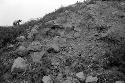 Detail of exposed masonry in southwest corner slope of huaca at Site 126