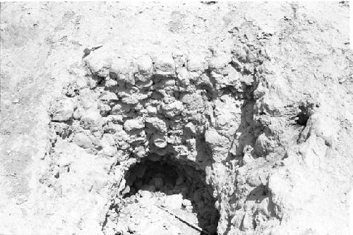 Construction detail of huaqueo at base of northwest slope at west corner of top of platform at Site 127