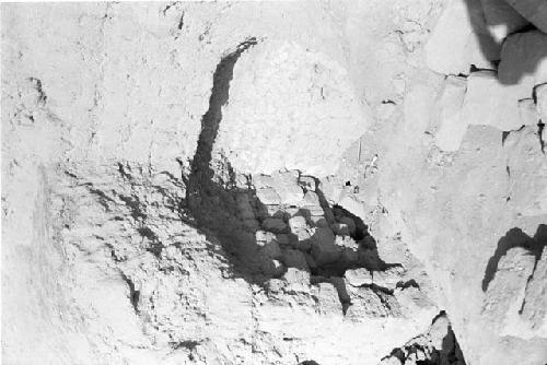 White plaster in east wall of Huaqueo C at Site 128