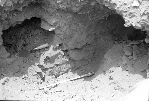 Buried wall of angular rock with mud-plaster at Site 133