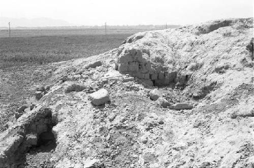 Detail of exposed masonry at west end of top of huaca at Site 124