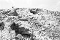 Detail of exposed masonry at west end of top of huaca at Site 124