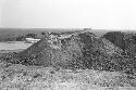 Adobe extraction site at east end of north face of Palacio (Structure A) at Site 128