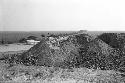 Adobe extraction site at east end of north face of Palacio (Structure A) at Site 128