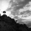 Men on rock cliff