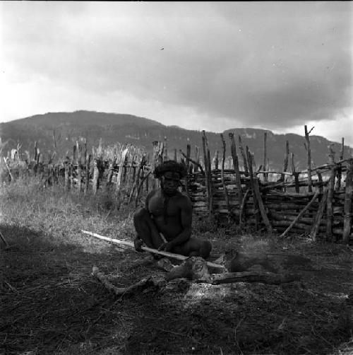 Yegé Asuk heating his lugu spear