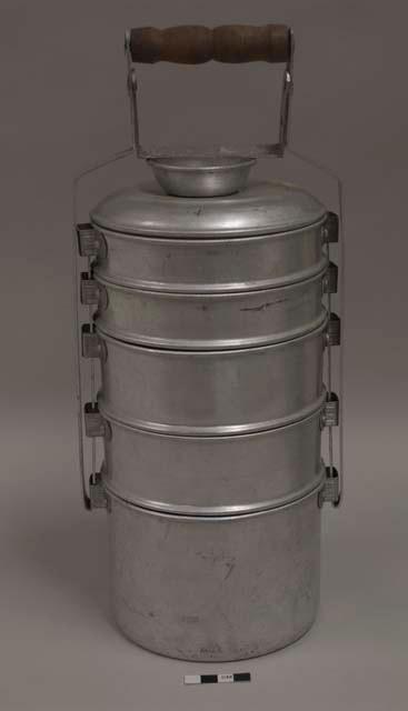 Tiffin, medium, with five sections; impressed mark of crown in circle surrounded by "+ BEST ALUMINUM + MADE IN INLAND"