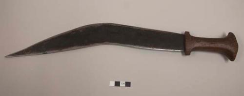 Sword with curved blade, wooden pommel; 1941 East Africa coin affixed to end of pommel