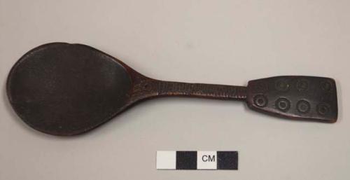 Carved spoon with pattern of incised circles