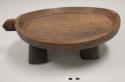 Wooden serving tray or table on four thick legs; projecting element at side of tray with hole; turtle form?