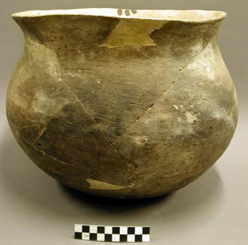 Ceramic jar, flared rim, brushed exterior, brown on yellow interior, reconstruct