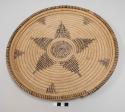 Coiled basketry tray; dark brown central star or floral motif, 5 triangles, and rim