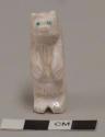 White stone fetish bear with turquoise eyes; standing on hind legs