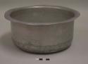 Aluminum cooking pot, round, everted rim; fifth of nesting set of 12 pots with lids; impressed mark of airplane with words "TRADE MARK" above and "PURE [ALUMINUM?]" beneath