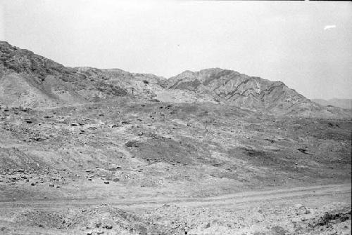 West end of Site 145 with woman standing on wall and Site 132 in background