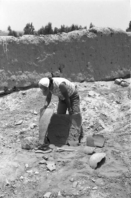 Giant ceramic sherds, vessel neck and perforated sherd at Site 146, with Feature 18 in background