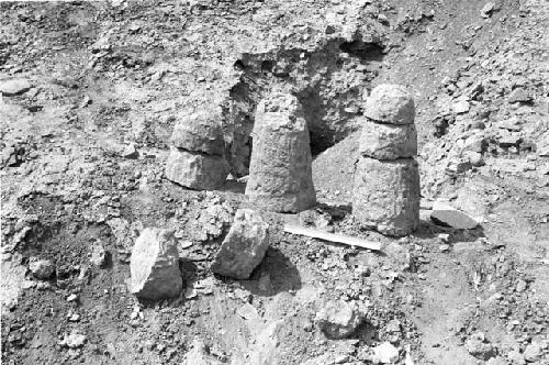 Conical and sectioned conical adobes at south edge of south platform at Site 146