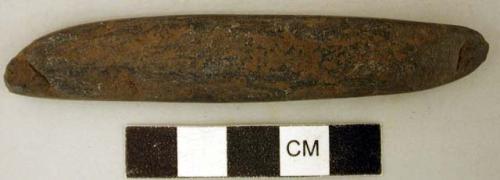 Ground stone implement, flat, elongated shape