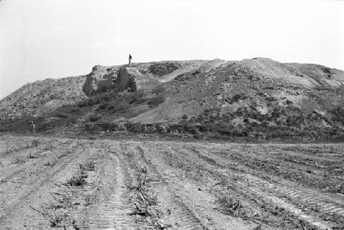 Southwest corner and west side of huaca at Site 177