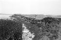 Ash layer above deposit of river cobbles and gravel along bluff at Site 189