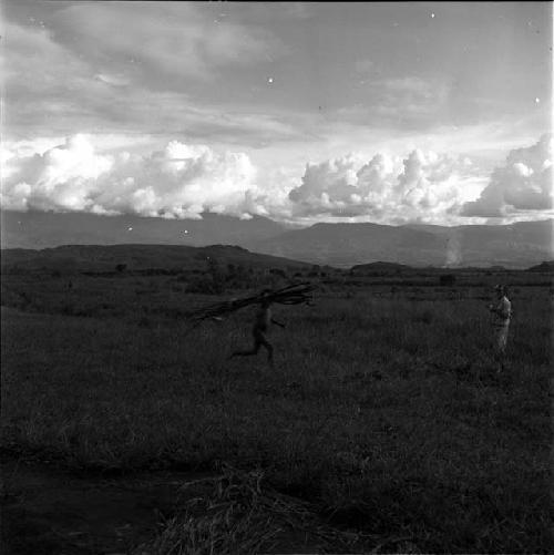 Man carrying wood