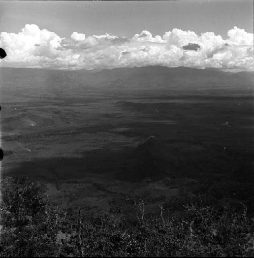 the Baliem Valley -- damaged negative, holes in left side of image