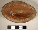 Ground stone, complete vessel, oval-shaped bowl/cup