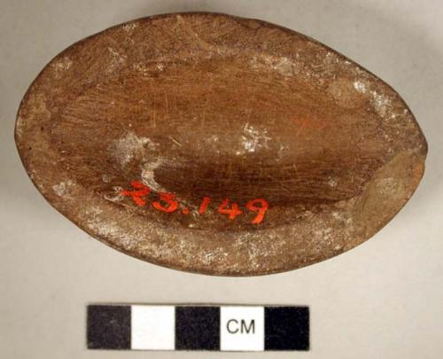 Ground stone, complete vessel, oval-shaped bowl/cup