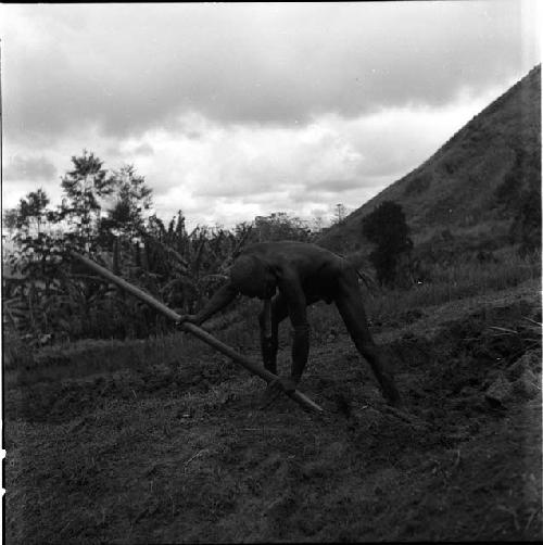 Alugu working in his garden