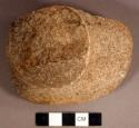 Ground stone, abrading stone fragment, possible muller, flared base