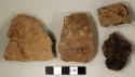 Coarse earthenware body sherds, some undecorated, one cord impressed