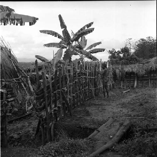 man repairing a fence