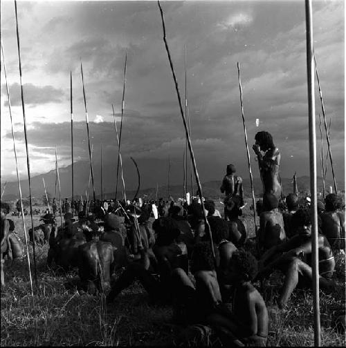 men standing with spears