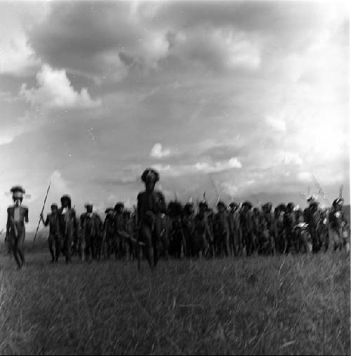 Men running towards camera